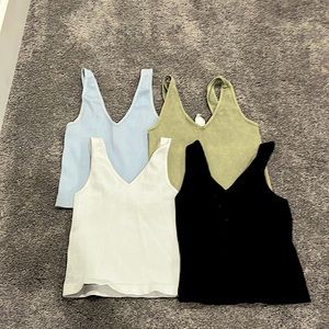 4 cute cropish tanks- they are all O/S, built for any body type!